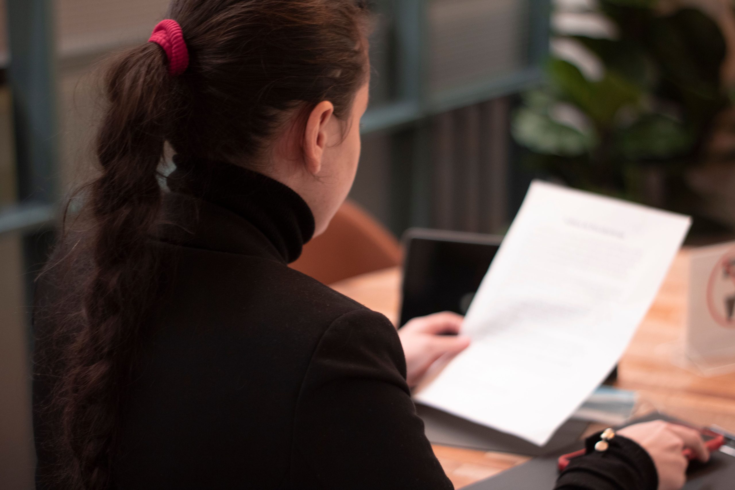 Confident mature woman posing in a modern office