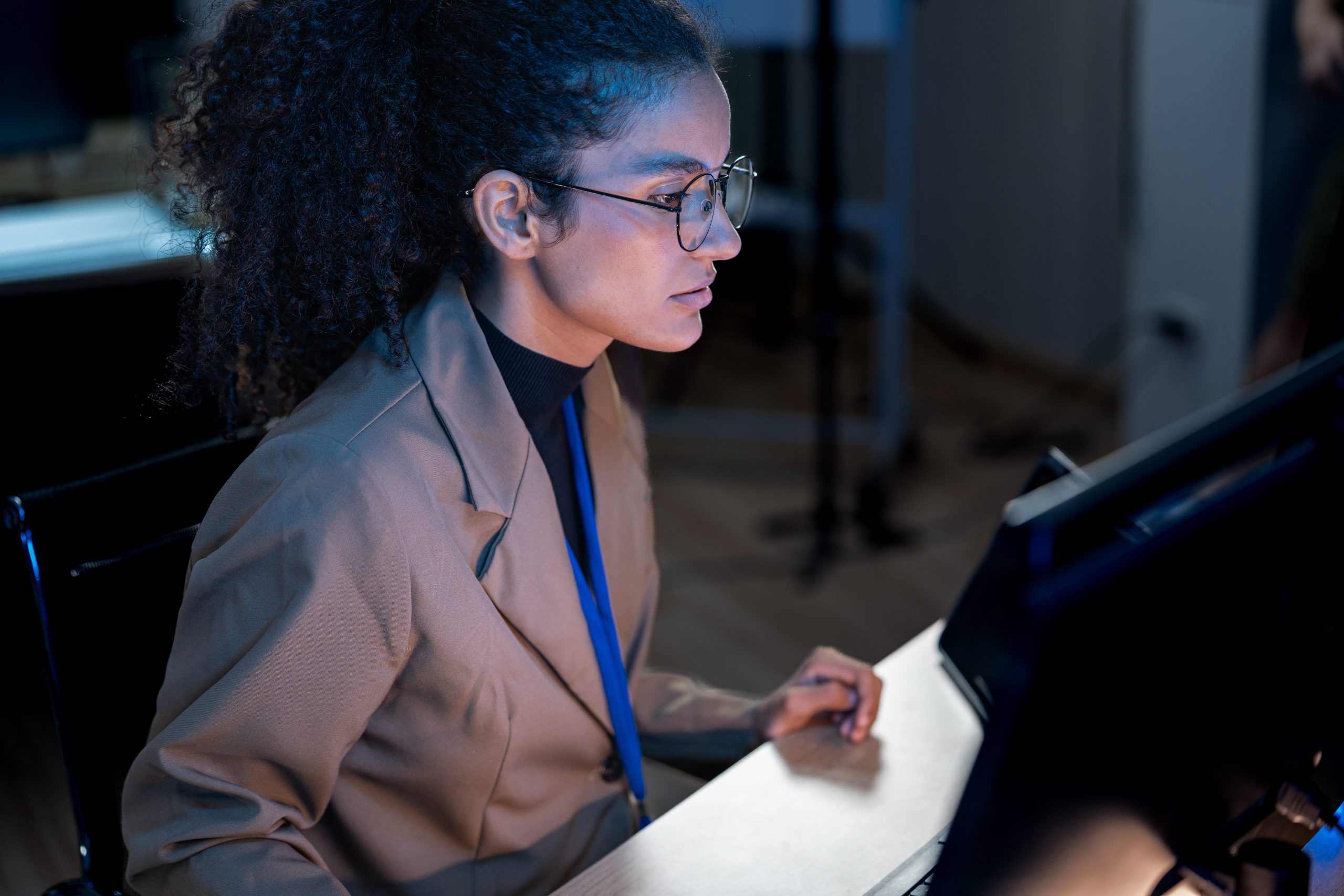 Professional woman working diligently on a computer for Sarasota Legal Services