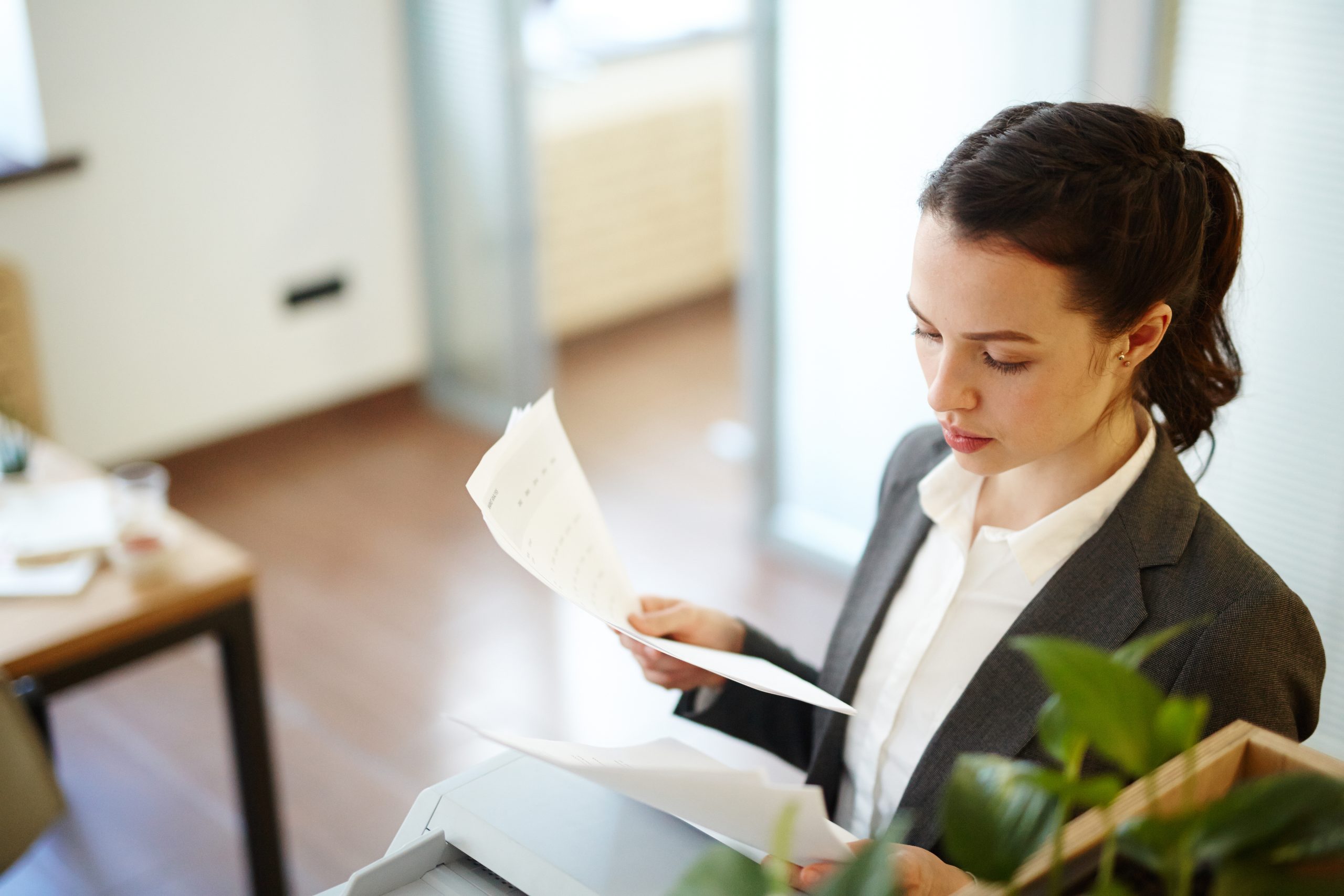 Attorney reviewing deposition paperwork in an office setting