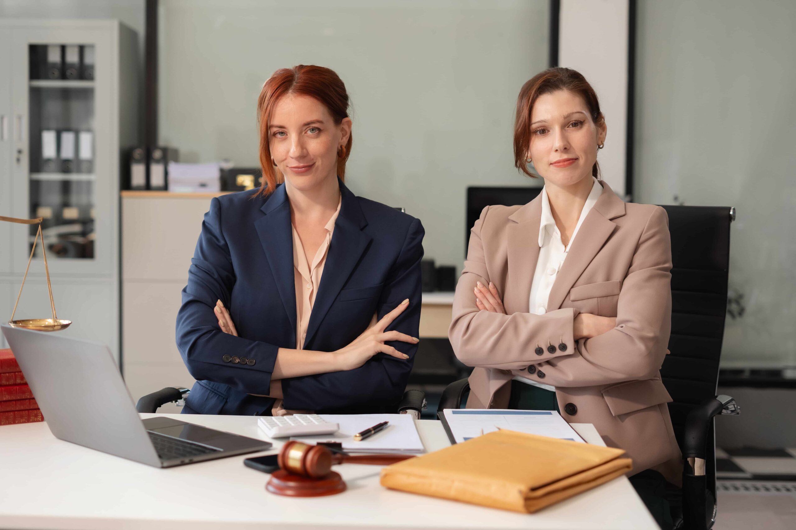Confident legal professionals collaborating in a modern office