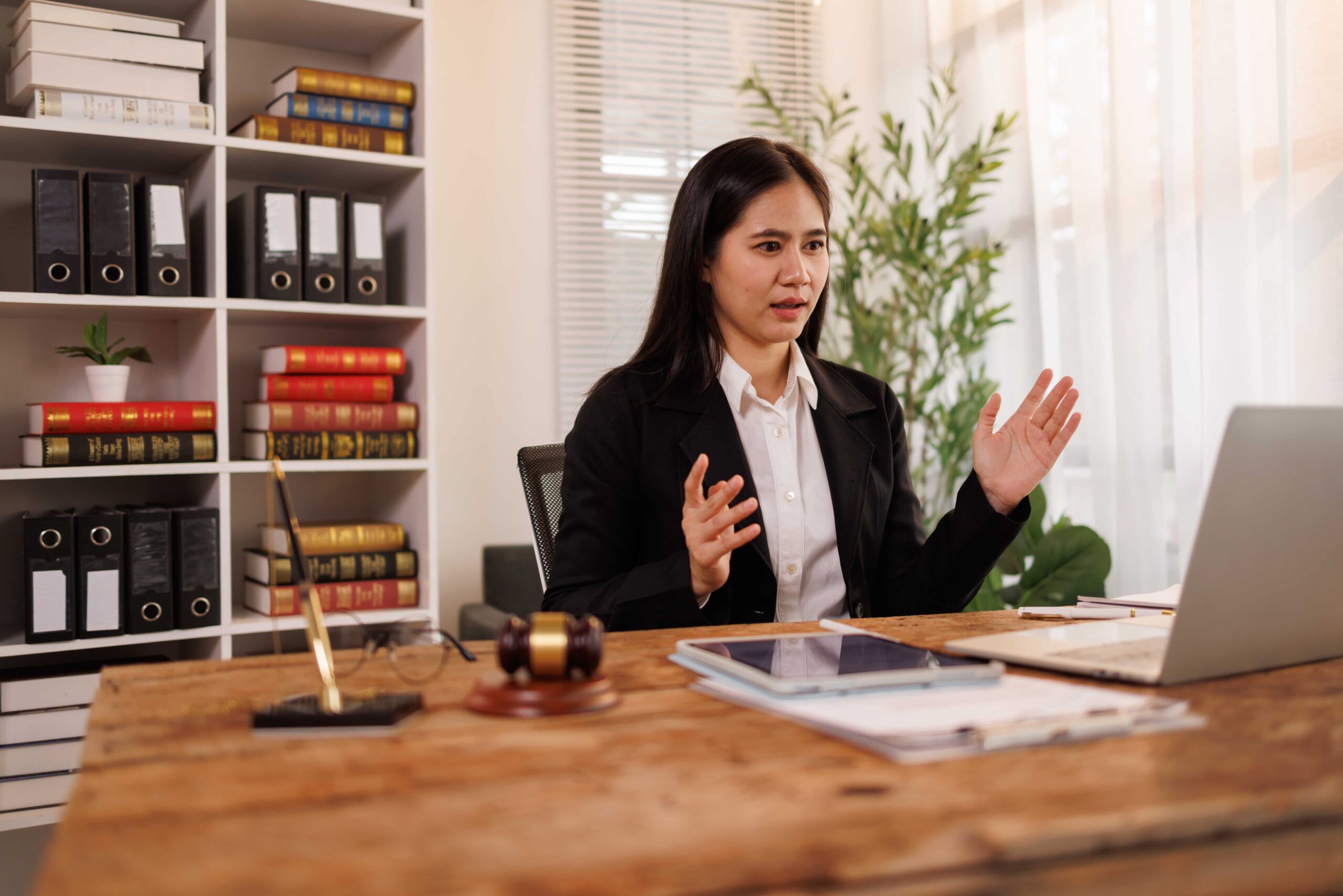 Professional woman attorney on a video call in her office